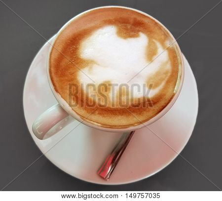 Delicious cappuccino coffee cup with cream froth