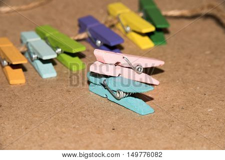 Colorful wooden clothespin. Background of colorful clothes pegs. Closeup of colorful clothespins.