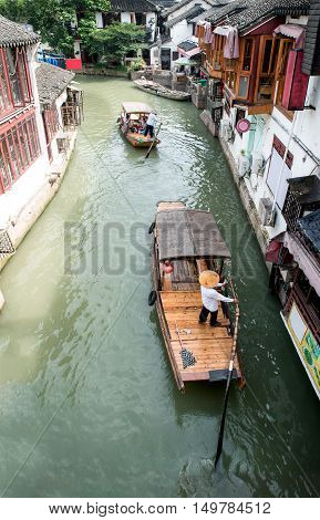 China traditional tourist boats on canals of Shanghai Zhujiajiao Water Town in Shanghai China
