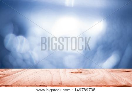 empty wood and dark blue blurred background / can be used display your product or art work