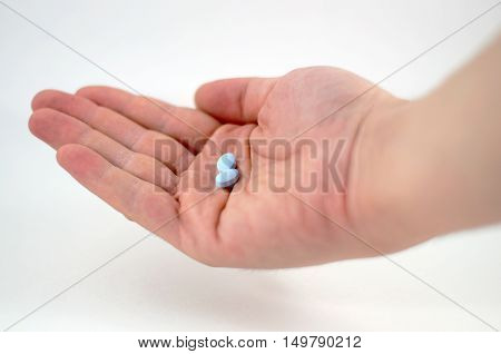 Male Hand With Blue Pills