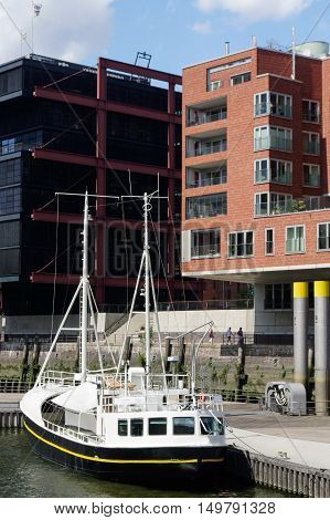 HAMBURG GERMANY - JULY 18 2015: a Modern architecture at Traditionsschiffhafen at Sandtorhafen located on the Elbe river islands with one boat on the water
