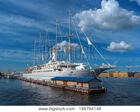 St. Petersbug Russia - August 5 2015: Cruise liner Wind Surf of Windstar Cruises Luxury Lines departs from the Neva river. The 5-masts ship provides luxury cruise for 310 guests