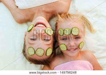 Beautiful girls with facial mask of cucumber.