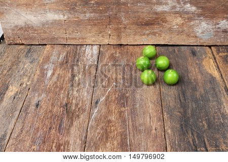 limes on the wooden table top view