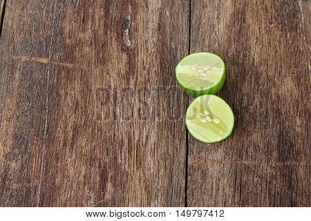 slice lemon on wooden table top view