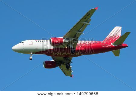 SAINT PETERSBURG, RUSSIA - AUGUST 24, 2016: Airbus A319-111 (VQ-BCP) of the airline Rossiya - Russian Airlines in the blue sky