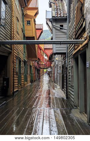 BERGEN, NORWAY - JULY 2, 2016: Quarter Bryggen is a special mini-city with winding streets wooden flooring underfoot and interesting architecture.