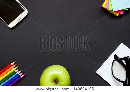 Mobile Phone, Apple And Stationery On The Desk