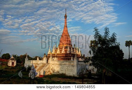 Stupa near Maha Aungmye Bonzan temple at sunset Ava Myanmar