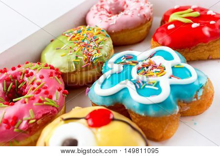 Six delicious, the colorful and bright donuts.
