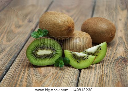Fresh juicy ripe kiwi on a wooden background