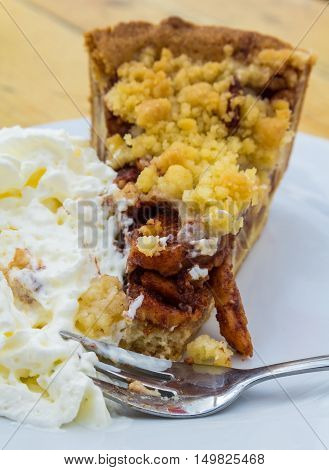apple tart with whipped cram on a plate