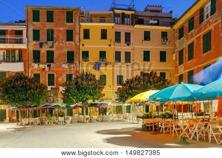 The old main square on the waterfront in the Italian village of Vernazza at night. Parco Nazionale delle Cinque Terre, Liguria, Italy.