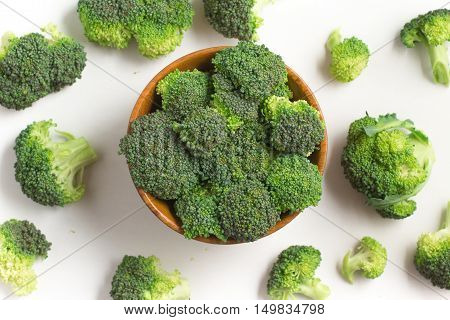 Broccoli into a bowl isolated in white background
