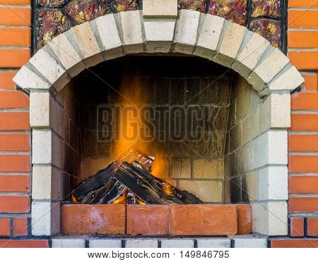 Fire in fireplace. Close Up of firewood burning in fire. Fireplace in the house. A fireplace in a country house