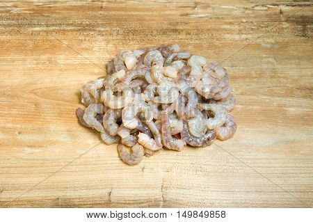 Raw Shrimp prepare for cooking on wood background.