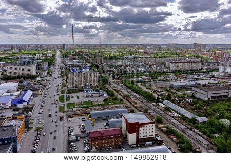 Tyumen, Russia - May 19, 2015: Aerial view on Permyakova and Harkovskaya streets intersection. On foreground: Ochakovo factory, Perestroyka trade center, Construction yard shop