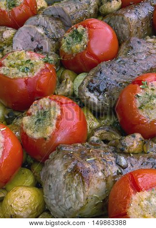 grilled pork tender loin with vegetables in provencal style