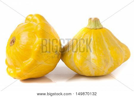 two yellow pattypan squash isolated on white background.