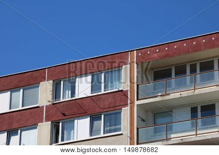 Detail of top of the prefabricated house two last floors of prefab also panel house with balcony and sky above