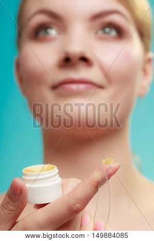 Woman Applying Balsam For Lips