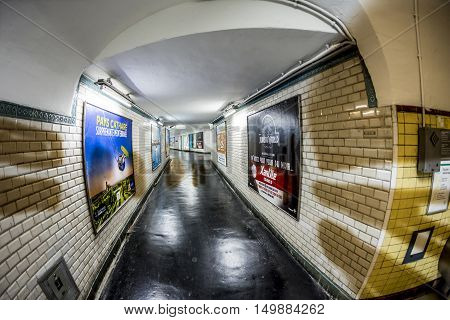 Advertising At The Wall Of An Old Metro Station In Paris