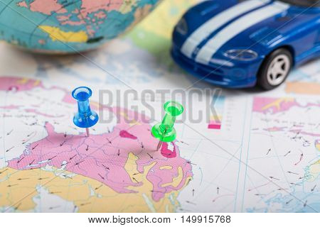 Road map Green push pin the location of destination by car on a map.