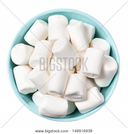 White Fluffy white marshmallows in blue bowl isolated on white background. Huge big marshmallow macro top view image