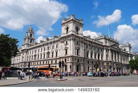 London, United Kingdom - June 21, 2014. The Government Offices building on Great George Street in London, with people and street traffic.
