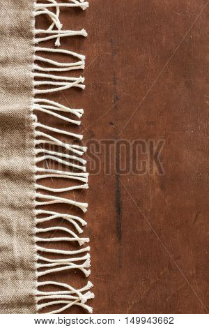 warm wool throw on wooden background