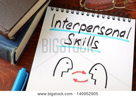 Interpersonal Skills written in a paper with a glasses.