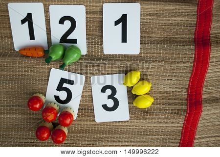 Early math with basic childish numbers wooden toy fruits