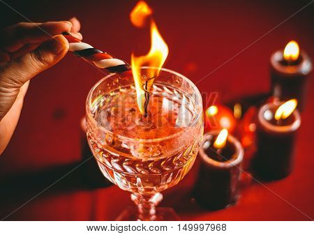 witch holds candle love spell on ritual