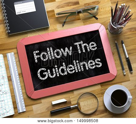 Small Chalkboard with Follow The Guidelines Concept. Follow The Guidelines on Small Chalkboard. 3d Rendering.