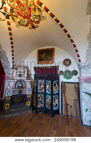 A Room With A Fireplace And Ceiling Paintings In The Mukachevo Palanok Castle. Mukachevo Ukraine