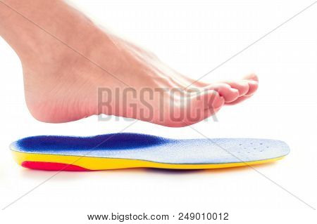 Orthopedic Insole And Female Leg Above It