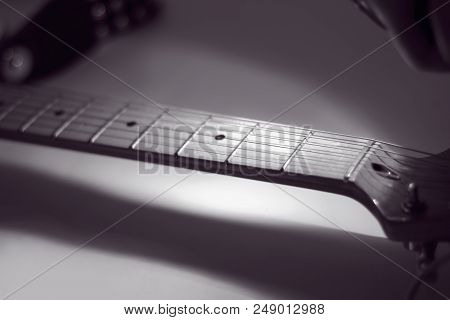 Black-and-white Image. Fingerboard Six-string Guitar. Retro Style. Photo With Copy Space