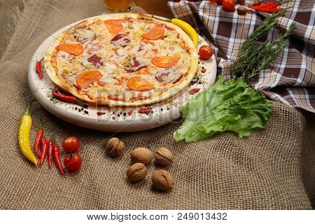 Pizza With Tomato, Cheese, Smoked Sausage, Boiled Sausage, Pepper Spices On A Wooden Tray Close-up