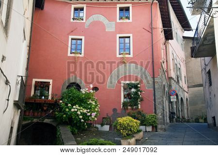 Narrow street in the medieval town of Barga in Tuscany, Italy