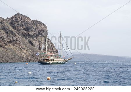 Wooden Ship For Trip Near Island Terasia And Santorini , Greece