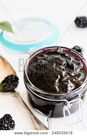 Homemade Blackberry Preserves In A Canning Glass Weck Jar With Attached Lid. Selective Focus On Jam.