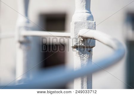 White Painted Decorative Wrought Iron Railing. Romantic Atmosphere Details Of Traditional Craftsmans