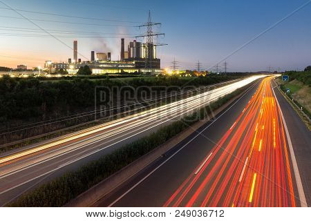 Long Exposure Sunset Over German Highway Along Power Plant Near Cologne In Germany
