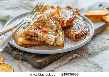 Crepe Suzette With Orange Sauce For A Delicious Breakfast, Selective Focus.