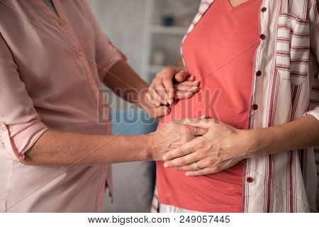 Pregnant Daughter. Pregnant Daughter Wearing Stylish Striped Shirt Feeling Amazing While Coming To H