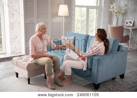 Supporting Woman. Supporting Woman Giving Glass Of Water To Thirsty Pregnant Woman Feeling Very Tire
