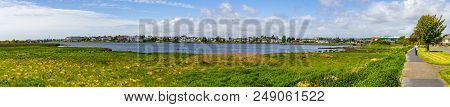 Lough Atalia Bay With Houses In Background