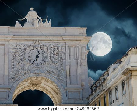 Arco Da Rua Augusta  In Lisbon At Night With Clock