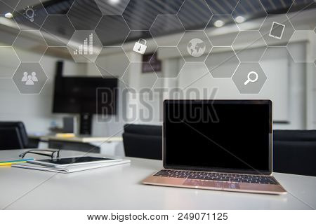 Laptop On The Table In The Meeting Room. Fintech And Technology